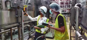 two engineers Using thermography to check the working status of steam traps