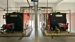 Boiler Room photo of 2 Marshall B Series Oil and Gas fired Industrial Steam Boiler installed inside a Textile Dyeing Plant in Thailand