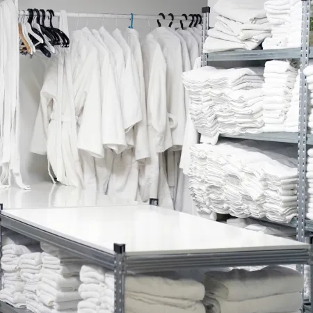 case study thumbnail - washed and ironed white clothes in the laundry of a hotel